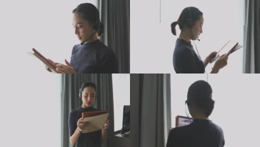 亚洲女性戴着耳机，用数字平板电脑视频开会，在家开会高清在线视频素材下载