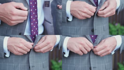 男人在婚礼前系好夹克的纽扣。认不出来的人高清在线视频素材下载