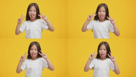 亚洲小女孩胜利的手势，伸出舌头，黄色背景高清在线视频素材下载