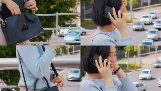 一个美丽的年轻女子在城市里散步时用手机接电话的4k视频高清在线视频素材下载