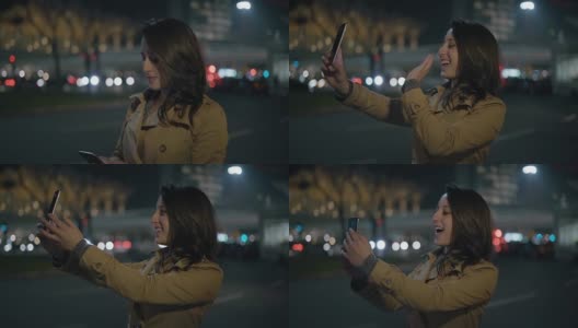 快乐女孩在街上通过智能手机视频聊天高清在线视频素材下载