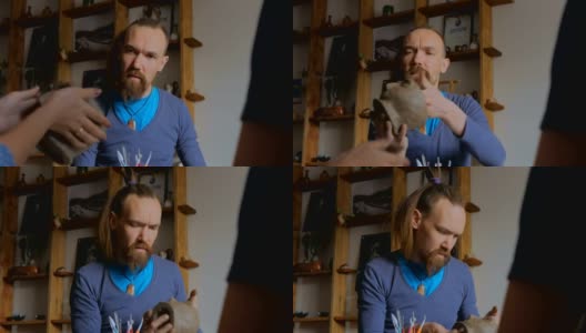 一名男子正在陶艺室演示如何制作陶土马克杯高清在线视频素材下载