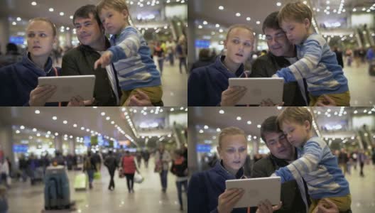 父母和孩子带着便签在拥挤的机场高清在线视频素材下载