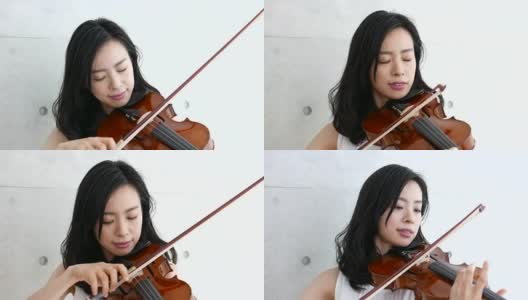 一个拉小提琴的女人，4K高清在线视频素材下载