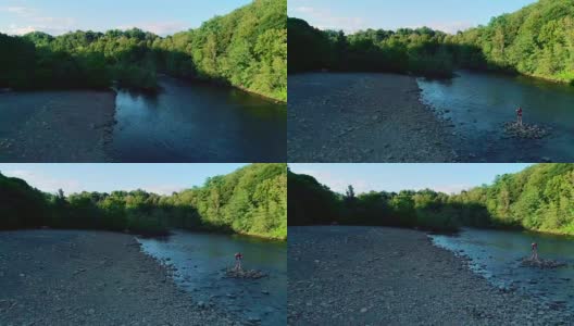 这位16岁的少女在日落时分宾夕法尼亚州吉姆·索普附近的利哈伊河前自拍。空中无人机视频。高清在线视频素材下载