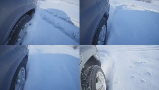 带有雪地车轮和冬季轮胎的Suv在雪地上行驶，近景高清在线视频素材下载