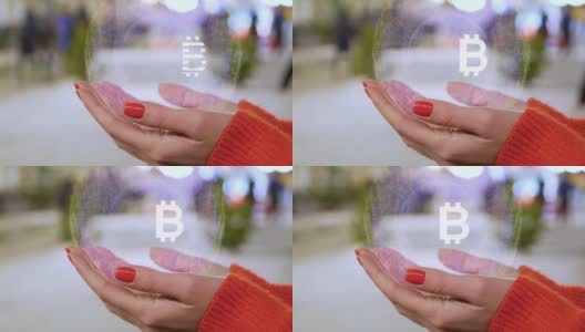 女性手握全息图与文字符号BTC高清在线视频素材下载