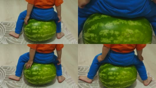 一个大西瓜和一个小男孩，孩子玩整个西瓜，高清在线视频素材下载