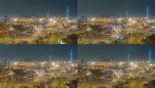 4K延时:码头商埠的集装箱货物仓库和工作吊车桥在夜间装卸集装箱，用于商业物流、进出口、运输高清在线视频素材下载