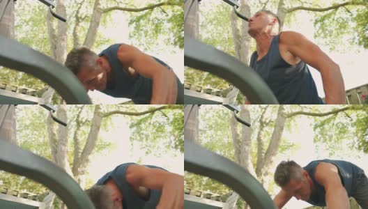 一个成熟的男人在后院的健身房锻炼高清在线视频素材下载