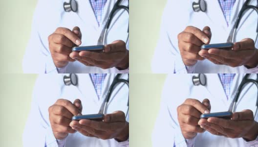 特写医生的手使用智能手机与拷贝空间高清在线视频素材下载