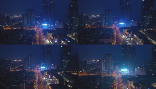 夜光照亮了青岛市市中心交通街道十字路口港湾航拍全景4k中国高清在线视频素材下载