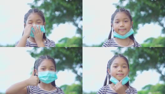 少女戴口罩微笑应对新冠肺炎疫情，慢镜头高清在线视频素材下载