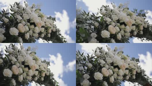 美丽的花装饰白玫瑰和绿色的花瓣。高清在线视频素材下载