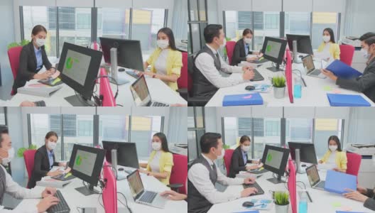 亚洲团队的商务人士在办公室工作与新的正常的社会距离的生活理念。男性和女性在一起时佩戴防护口罩，保持距离，防止冠状病毒感染高清在线视频素材下载