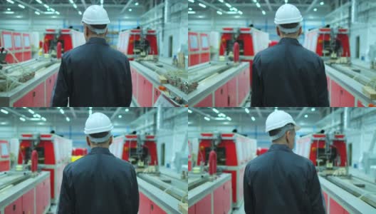跟随镜头的专业韩国，亚洲男性工程师男子戴安全帽高清在线视频素材下载