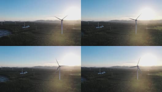航拍日落时壮丽的风力发电场高清在线视频素材下载