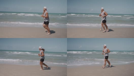 情侣一起在沙滩上跑步高清在线视频素材下载