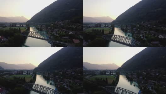 无人机鸟瞰瑞士因特拉肯。村庄和瑞士阿尔卑斯山围绕着inter laken。高清在线视频素材下载