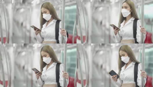 乘坐地铁时戴着智能手机的4K年轻女性高清在线视频素材下载