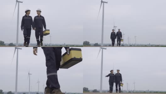 两名亚洲工程师统一检查工程师准备和进度检查风力涡轮机与安全在泰国风电场。高清在线视频素材下载