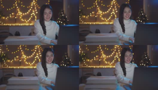 年轻的亚洲女商人使用笔记本电脑在家里工作到深夜高清在线视频素材下载