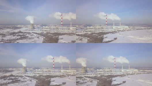 电厂空中景观上的烟囱和锅炉管道。冬季景观白色烟雾从工业管道化工厂在现代城市高清在线视频素材下载