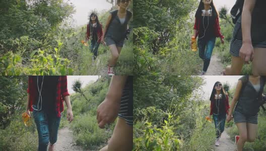 在山林中徒步旅行的年轻女子。高清在线视频素材下载