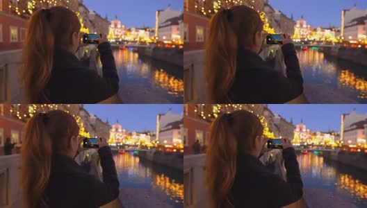 游客在圣诞节期间拍摄卢布尔雅那的照片高清在线视频素材下载