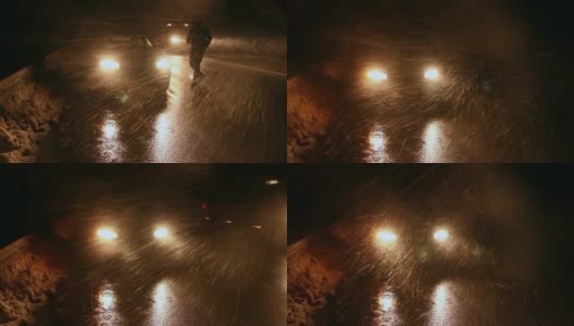一个男人和他的车被困在暴风雨中。高清在线视频素材下载