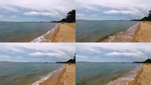 热带海滩的观点，海浪撞击一个空的海滩从上面高清在线视频素材下载
