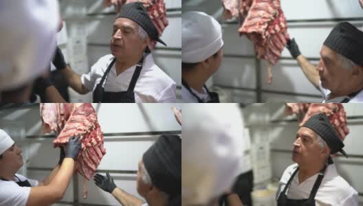 屠夫在肉柜里分析肉高清在线视频素材下载