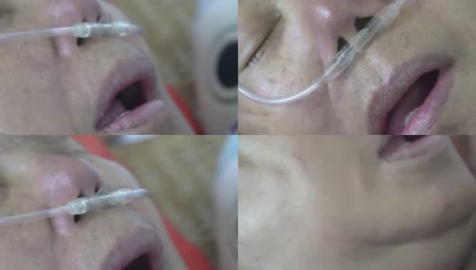 老年妇女用鼻呼吸管帮助她在家呼吸高清在线视频素材下载