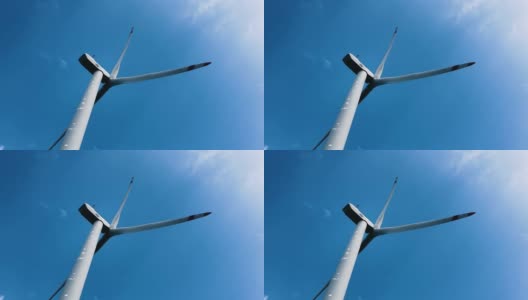 白色风力发电机在晴朗的蓝天-南丫风力发电站高清在线视频素材下载