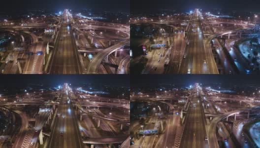 鸟瞰夜间公路交叉口，汽车交通与运输技术概念高清在线视频素材下载