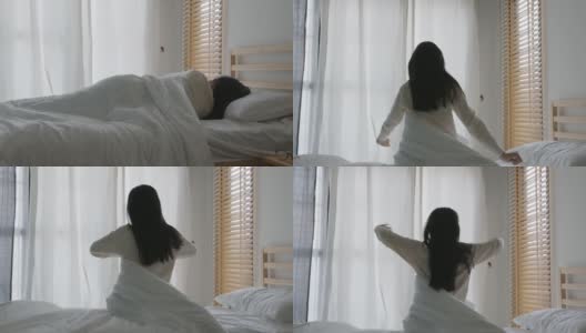 亚洲妇女睡在床上，早上醒来时伸展她的手臂高清在线视频素材下载
