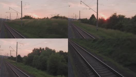 窗外的景色，高速列车上美丽的自然景观，野外和森林，铁路轨道，傍晚日落，在夏天的背景。交通、旅游、铁路、通讯理念高清在线视频素材下载
