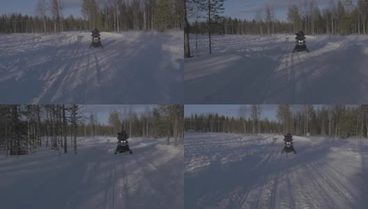 雪地摩托跟踪拍摄与两个骑手高清在线视频素材下载