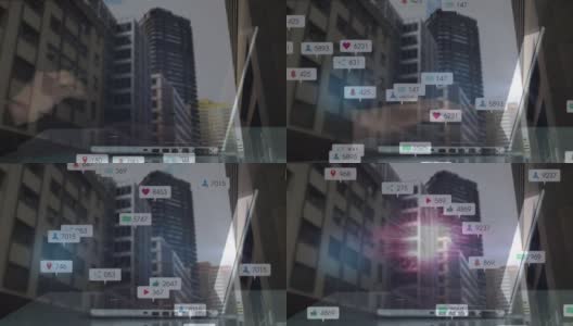 网络连接的动画与社会媒体图标和数字在笔记本电脑和城市景观高清在线视频素材下载
