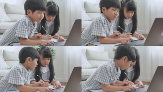 亚洲的兄弟姐妹们从在家开电话会议的老师那里在线学习。高清在线视频素材下载