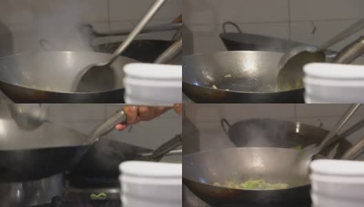 厨师在火上用平底锅做饭高清在线视频素材下载
