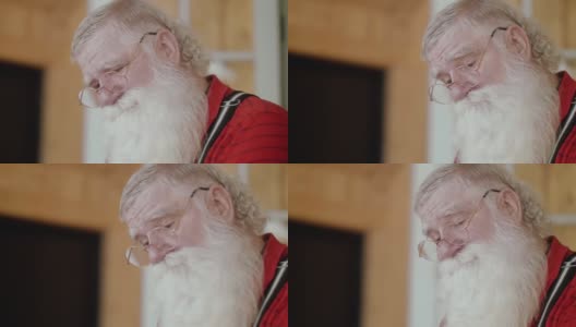 圣诞老人用不同表情阅读(慢动作)高清在线视频素材下载