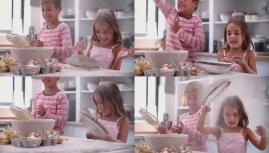慢动作拍摄的孩子在厨房凌乱的乐趣高清在线视频素材下载