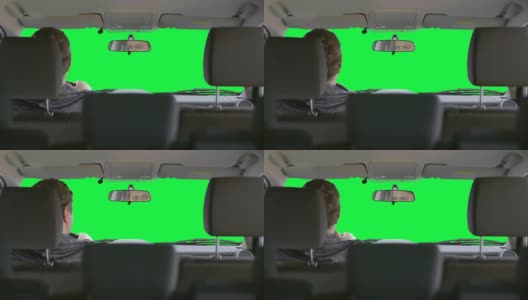 一个人在绿色背景下开车高清在线视频素材下载