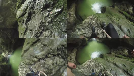 一个面目全非的人从一个高高的山崖跌落到河流域高清在线视频素材下载