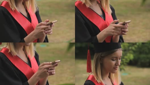 毕业典礼后用智能手机发短信的漂亮金发毕业生高清在线视频素材下载