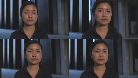 严肃的年轻中国女人的特写慢镜头，4k高清在线视频素材下载