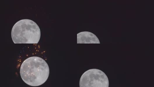 巨大的满月在黑暗的天空中，美丽多彩的节日烟花在夜空中与7月4日显示独立日高清在线视频素材下载