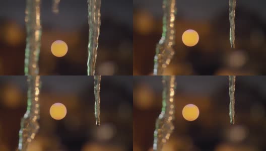 冰柱在夜间融化近景散景拍摄高清在线视频素材下载