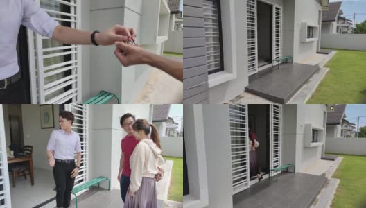 一对亚洲的中国夫妇从房地产经纪人那里拿到了新房钥匙，并参观了他们的新房高清在线视频素材下载